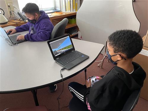 students at laptops